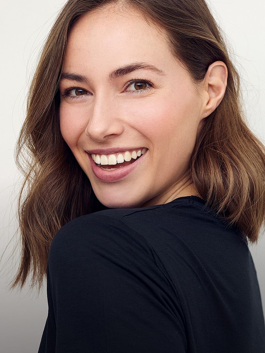 Smiling woman with medium-length brown hair.